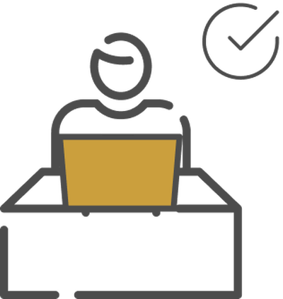 a person sits at a desk icon with a computer